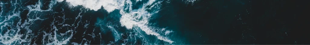 A photograph of deep blue ocean waves.