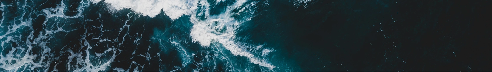 A photograph of waves crashing in the ocean.